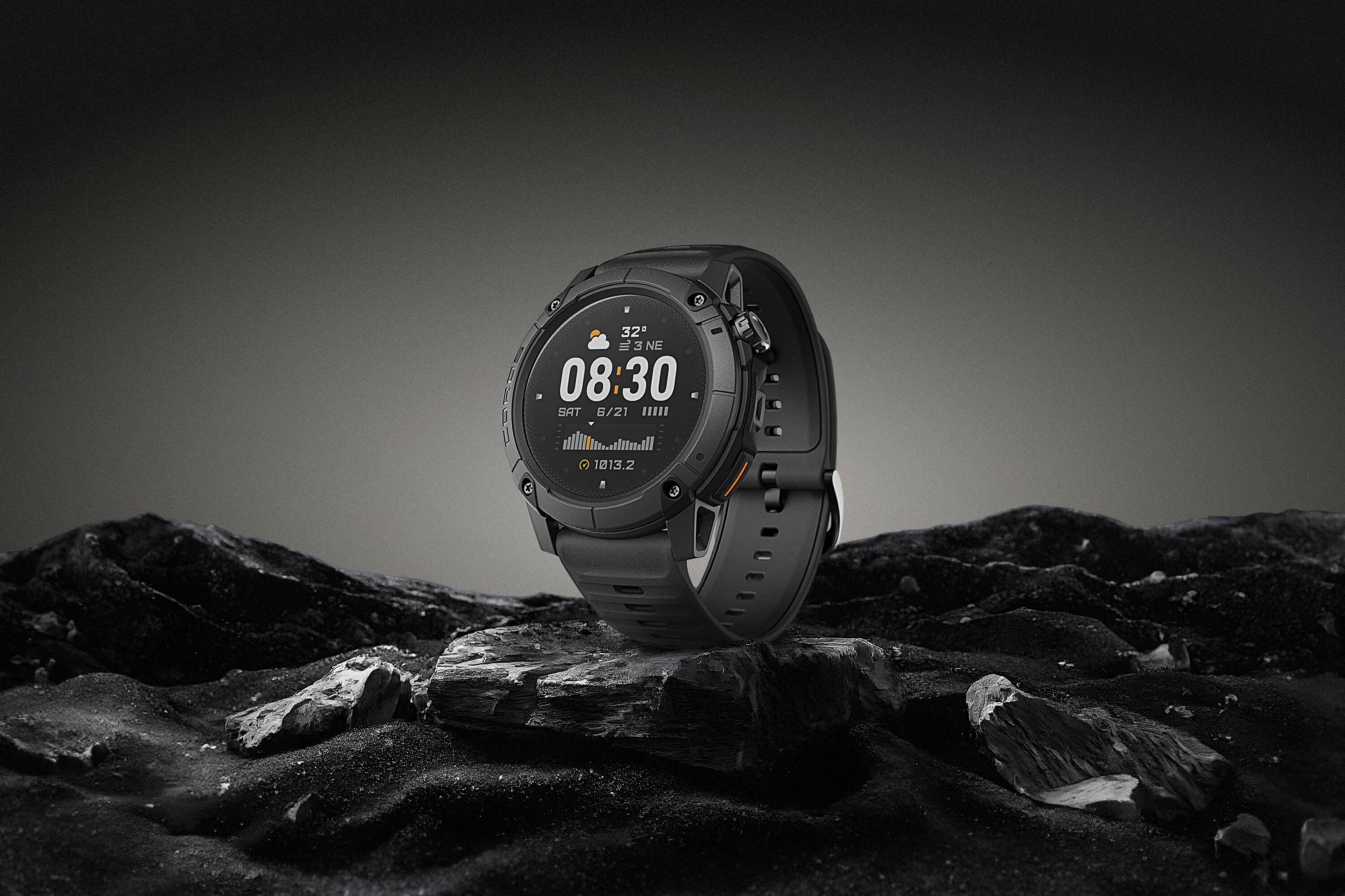 Coros NOMAD outdoor GPS watch with dark grey band, featuring adventure journal and over 40 sport modes, in studio setting