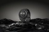 Coros NOMAD outdoor GPS watch with dark grey band, featuring adventure journal and over 40 sport modes, in studio setting