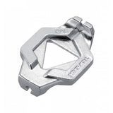 Topeak Duo Spoke Wrench tool for precise bike wheel spoke adjustments, shown on a workshop workbench.