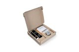 Brooks bike repair kit with fabric patches, glue, and zip wax in tan, designed for travel bags and cycling accessories.