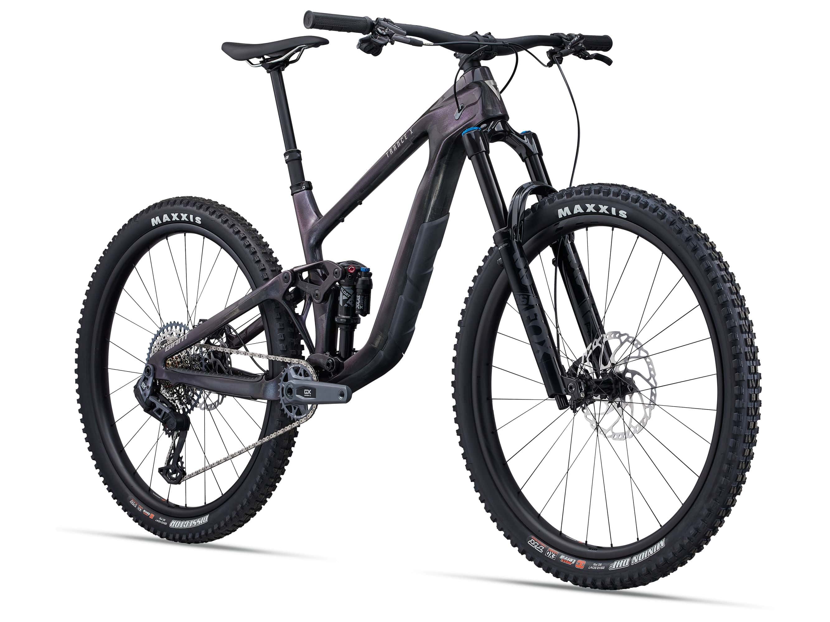 Giant Trance X Advanced 1 mountain bike with 29-inch wheels and Maestro suspension, shown outdoors on rugged terrain.