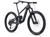 Giant Trance X Advanced 1 mountain bike with 29-inch wheels and Maestro suspension, shown outdoors on rugged terrain.