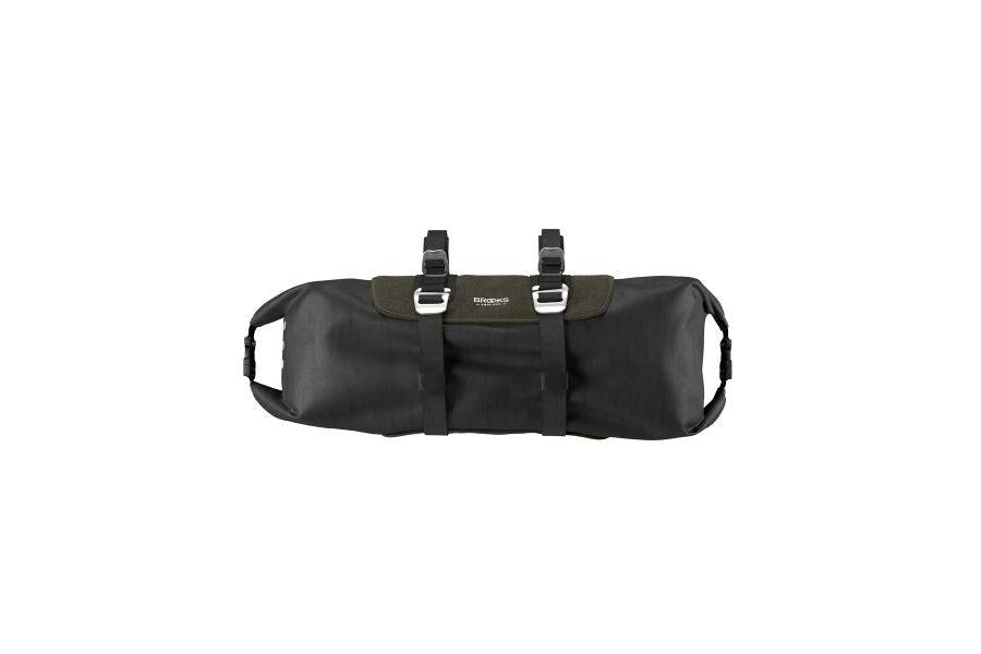 Brooks Scape handlebar roll bag in waterproof mud green for bikepacking, mounted on a bicycle handlebar.