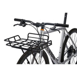 Cinelli Zydeco Silver Bootleg gravel bike with front rack, suitable for urban commuting and mixed terrain riding.