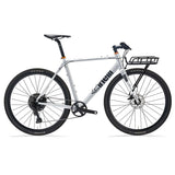 Cinelli Zydeco Silver Bootleg gravel bike with front rack, designed for urban commuting and mixed terrain riding.