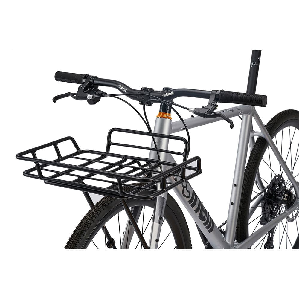 Cinelli Zydeco Silver Bootleg gravel bike with front rack, ideal for urban commuting and mixed terrain riding.