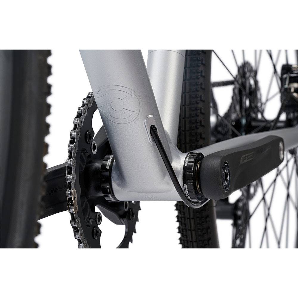 Cinelli Zydeco Silver Bootleg gravel bike with front rack, designed for urban commuting and mixed terrain riding.