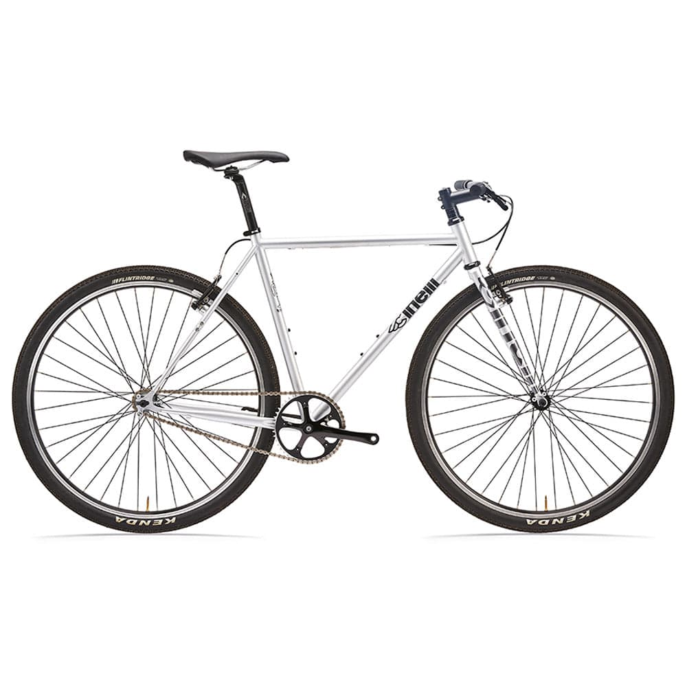 Silver Cinelli Tutto Plus flat bar road bike with urban commuting and racing features, shown from a side angle.
