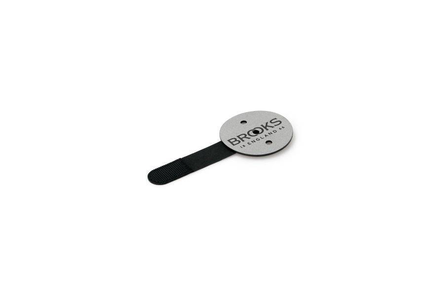 Brooks Scape Reflective Patch in black and silver, safety visibility accessory for bags, made for enhanced nighttime safety.