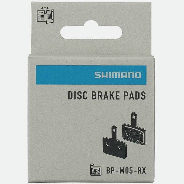 Shimano M05-RX resin disc brake pads with steel back plate for 2 piston bike disc brakes, close-up view of components