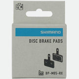 Shimano M05-RX resin disc brake pads with steel back plate for 2 piston bike disc brakes, close-up view of components