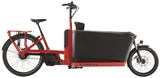 Trek Fetch+ 4 electric cargo bike with Bosch Performance Line CX motor and customizable child seating in a city setting.