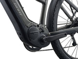 Giant Explore E+ 4 Stagger MY26 e-hybrid bike with Long-Range EnergyPak 800 battery and Aegis safety features, parked outdoors.