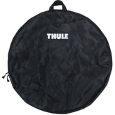 Thule 563 Wheel Bag XL for bike wheels up to 29 inches, showing padded exterior and internal pocket for accessories.