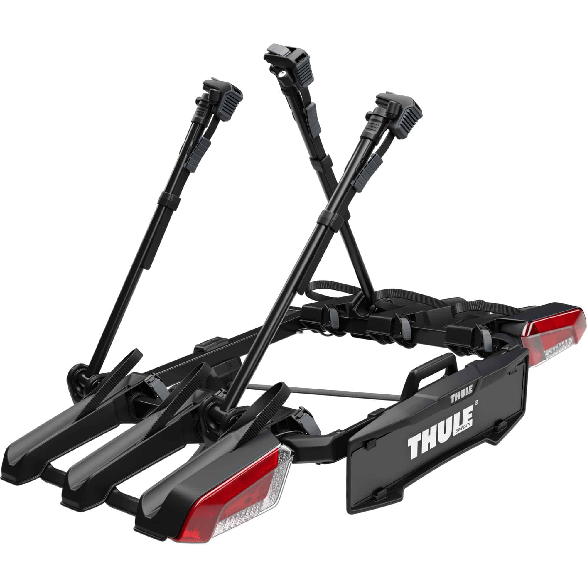 Thule OutPace 3-bike towball carrier with foldable design and 13-pin connector, mounted on a vehicle for bike transport.