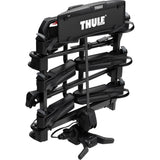 Thule OutPace 9013200 3-bike towball carrier with foldable design and 13-pin connector, suitable for attaching to a vehicle.