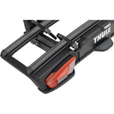 Thule VeloSpace 3 2-bike towball carrier with 13-pin connector for e-bikes, shown mounted on a vehicle.