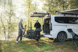 Thule VeloSpace 3-bike towball carrier with 13-pin connector for e-bikes and mountain bikes, shown installed on a vehicle.