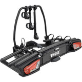 Thule VeloSpace 3-bike towball carrier with 13-pin connector for e-bikes and mountain bikes, mounted on a vehicle.
