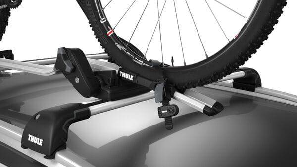 Thule Wheel Strap Locks for bike carriers with secure plastic straps and 2 included adaptors, designed for safe bike transport.