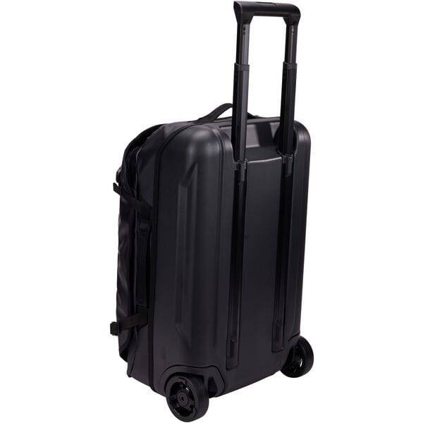 Black Thule Chasm Carry On wheeled suitcase with durable design and oversized wheels for easy travel.