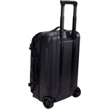Black Thule Chasm Carry On wheeled suitcase with durable design and oversized wheels for easy travel.