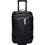 Black Thule Chasm Carry On wheeled suitcase with durable design and oversized wheels, ideal for travel and accessories.