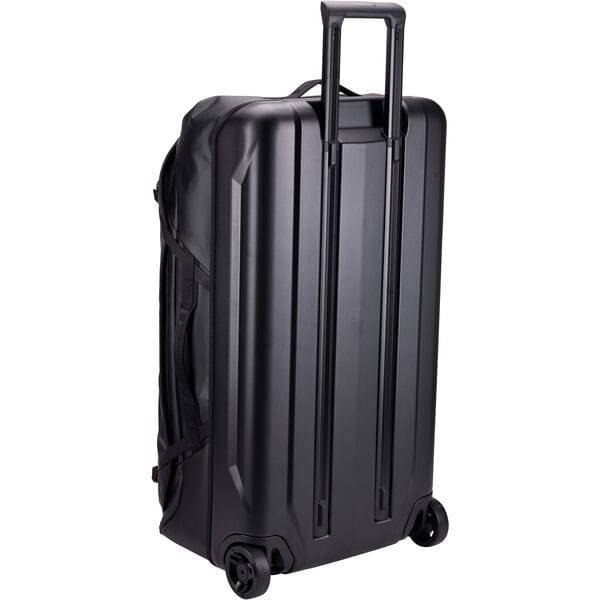 Thule Chasm rolling duffel bag in black, weather-resistant travel gear with durable construction and side handles.