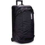 Black Thule Chasm rolling duffel bag with durable weather-resistant fabric, designed for travel and outdoor accessories.