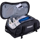 Thule Chasm recycled 30L duffel bag with convertible backpack straps, shown in black with side zipper pocket and durable design.