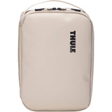 Thule Chasm Medium Gear Cube Soft Sand weather-resistant organizer bag with multiple compartments for accessories.