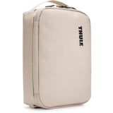 Thule Chasm Medium Gear Cube Soft Sand weather-resistant organizer bag with multiple compartments for accessories.