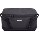 Thule Chasm Gear Hauler waterproof semi-rigid storage bag for travel and camping accessories, shown in black with sturdy handles.