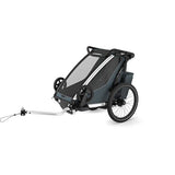 Thule Chariot Cross 2 child carrier with cycling and strolling kit, showing the versatile accessory for single-child transport.