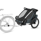 Thule Chariot Cross 2 double child carrier with cycling and strolling kits, featuring a sturdy frame and padded seats.