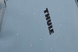 Thule Chasm Tote InLock 25L water-resistant bike rack-compatible tote bag with adjustable straps and sturdy design.