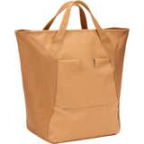 Thule Chasm Tote InLock 25L water-resistant tote bag with bike rack compatibility, shown with its sturdy handles and sleek design.