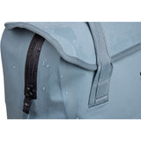 Thule Shield 23L waterproof backpack with InLock bike rack attachment, shown with secure straps and rugged design.