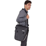 Black Thule Shield Commuter Pannier with 22L capacity, waterproof design, featuring a padded laptop sleeve for cycling accessories.