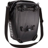 Thule Shield waterproof panniers with reflective panels and adjustable mounts for bike accessories.