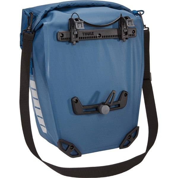 Thule Shield waterproof panniers with reflective panels and adjustable mounts, designed for bike accessories.