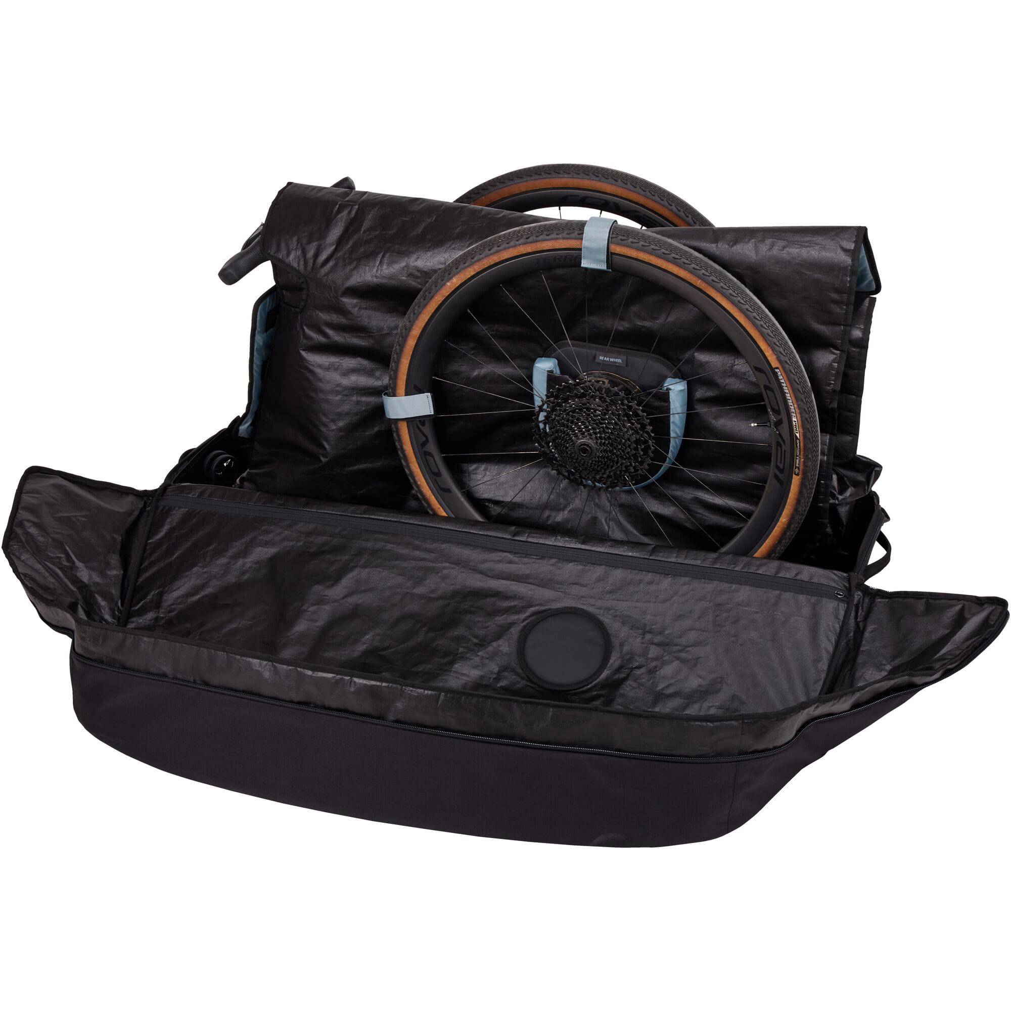 Thule RoundTrip Road Bike Case with integrated work stand for travel protection, showing the durable bike travel case and stand setup.