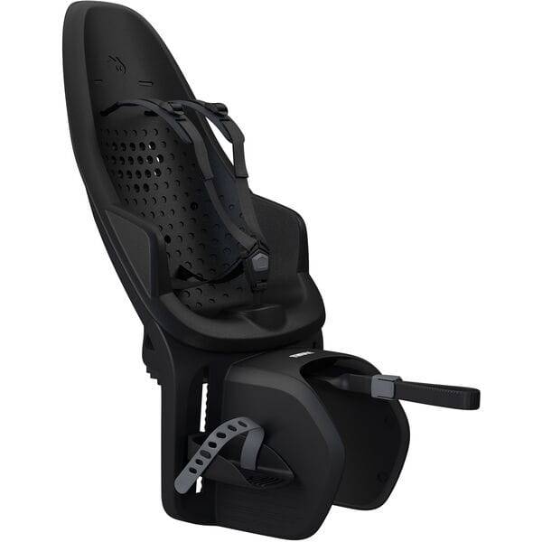 Black Thule Yepp 2 Maxi MIK HD child bike seat with click-in mounting system, showing secure attachment and ergonomic design.