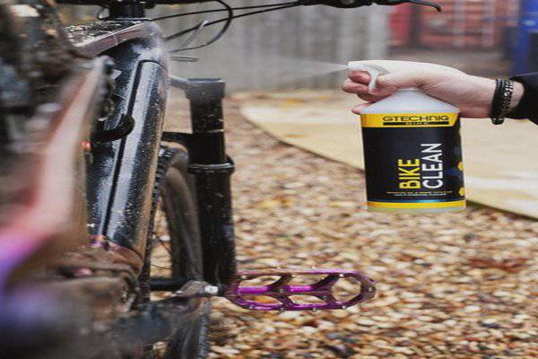 Gtechniq Bike Clean Premium bicycle cleaner with smart surface technology in a workshop setting, ready for bike cleaning.