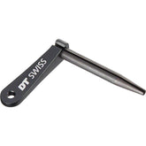 Black DT Swiss Aero Bladed Spoke Holder for Aero Comp and New Aero spokes, shown on a workshop workbench.