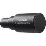 Shimano Spares TL-HB017 bike hub bearing remover tool for bike maintenance, shown in a workshop setting.
