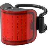 Knog Lil' Cobber bike light showing waterproof design, USB charging port, and 330° visibility on a bike handlebar.
