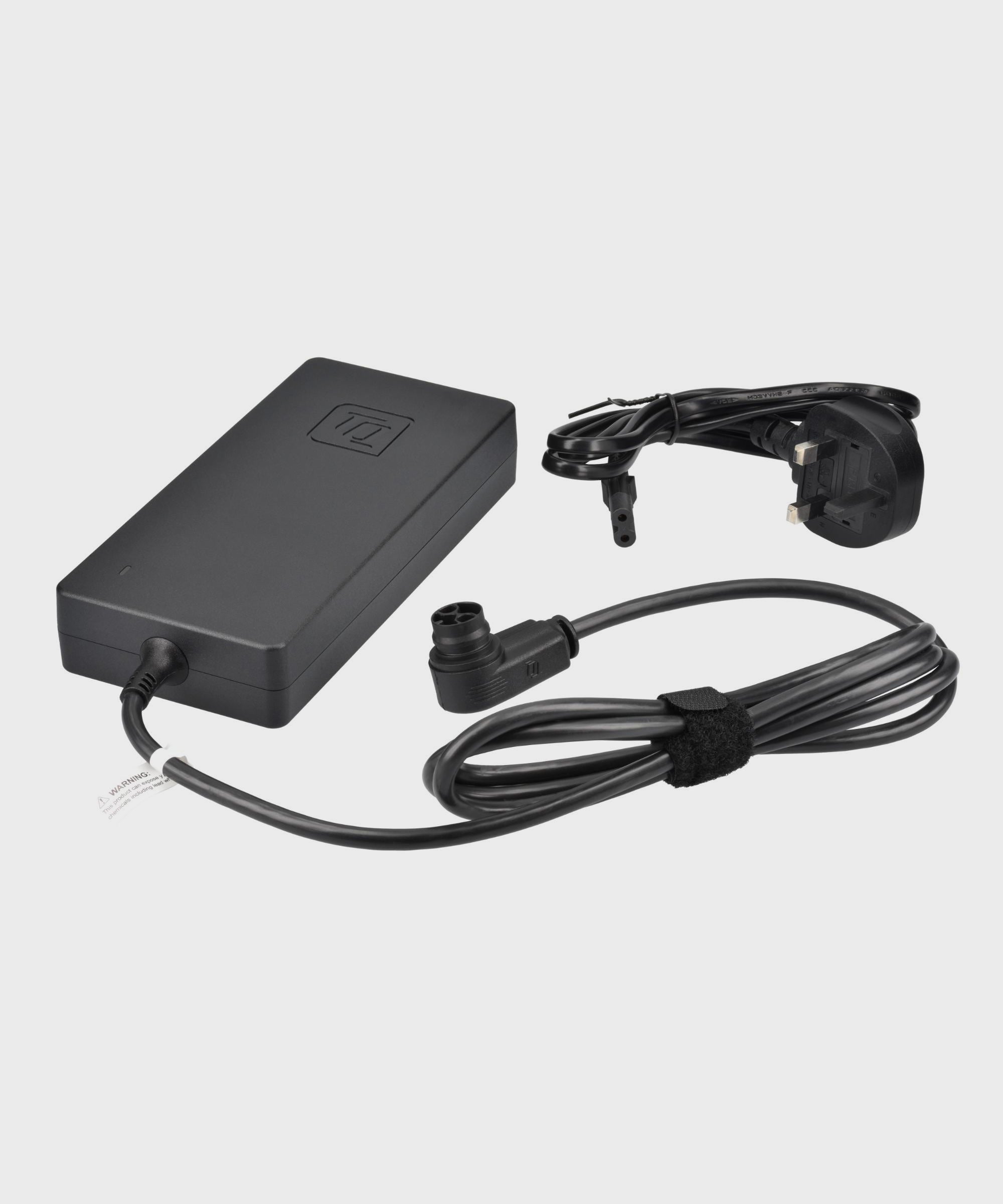 TQ UK e-bike charger with 2A and 4A output options, designed for TQ e-bike components, shown in the image.