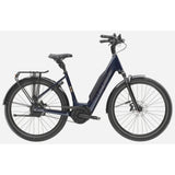 Trek District+ 5 Lowstep 2025 urban commuter e-hybrid bike with step-through frame and electric assist for city riding.