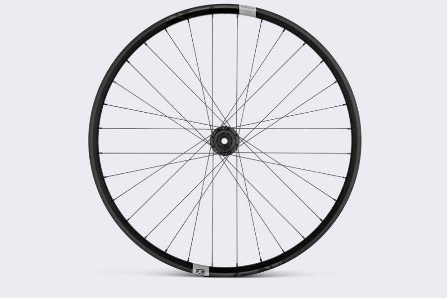 Crank Brothers Synthesis Alloy XCT rear mountain bike wheel with I9 hub, featuring a sleek black rim and durable components for mountain biking